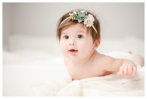 Cute baby on belly photos