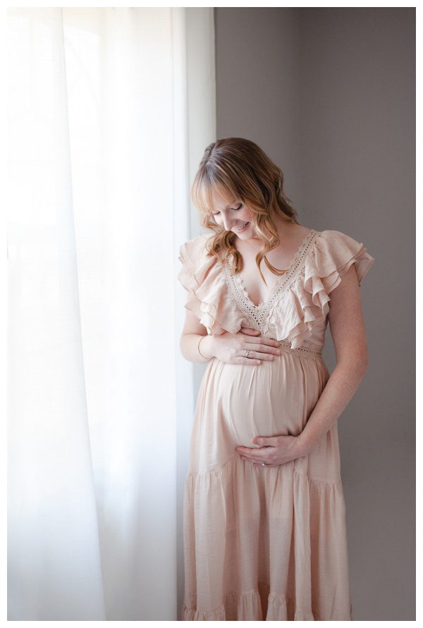 Fairfield County Maternity Photographer Studio Maternity Photographs - mom looking down at her pregnant belly