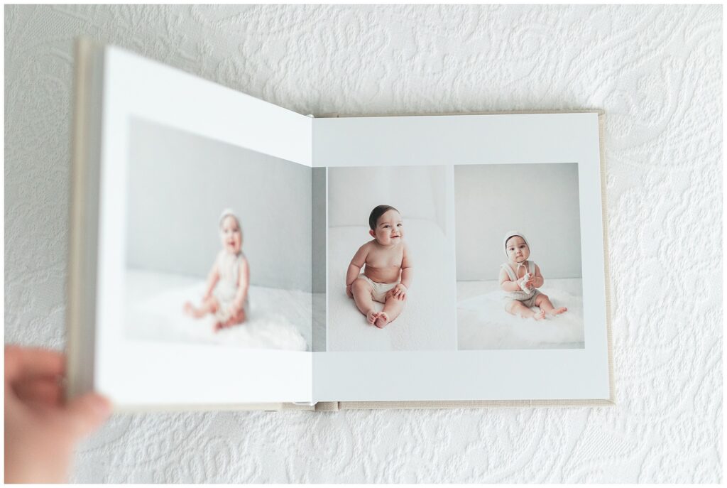 Beautiful heirloom album of pictures from newborn photo session. Adorable baby portraits by a professional photographer in Fairfield County, CT.