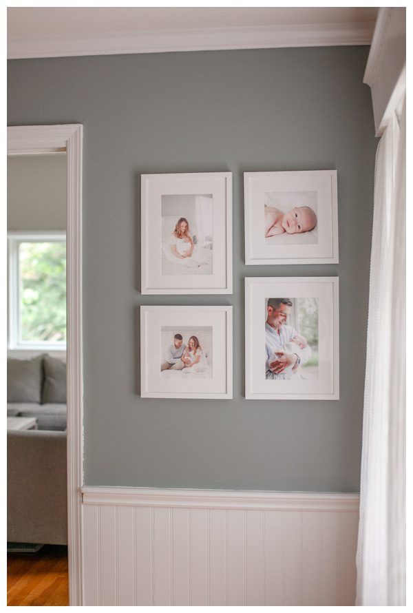Custom framed newborn portraits displayed in home