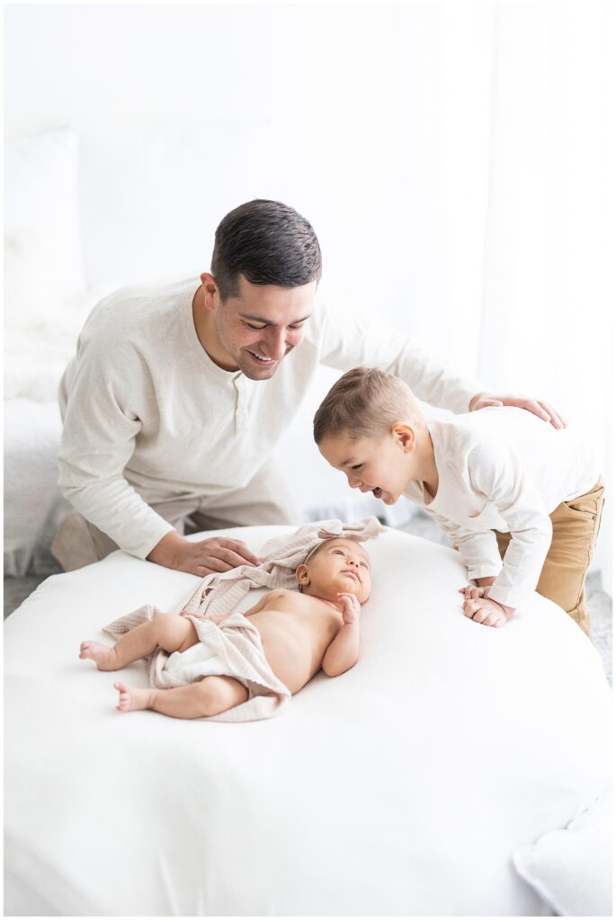 Father and son included in newborn portrait session