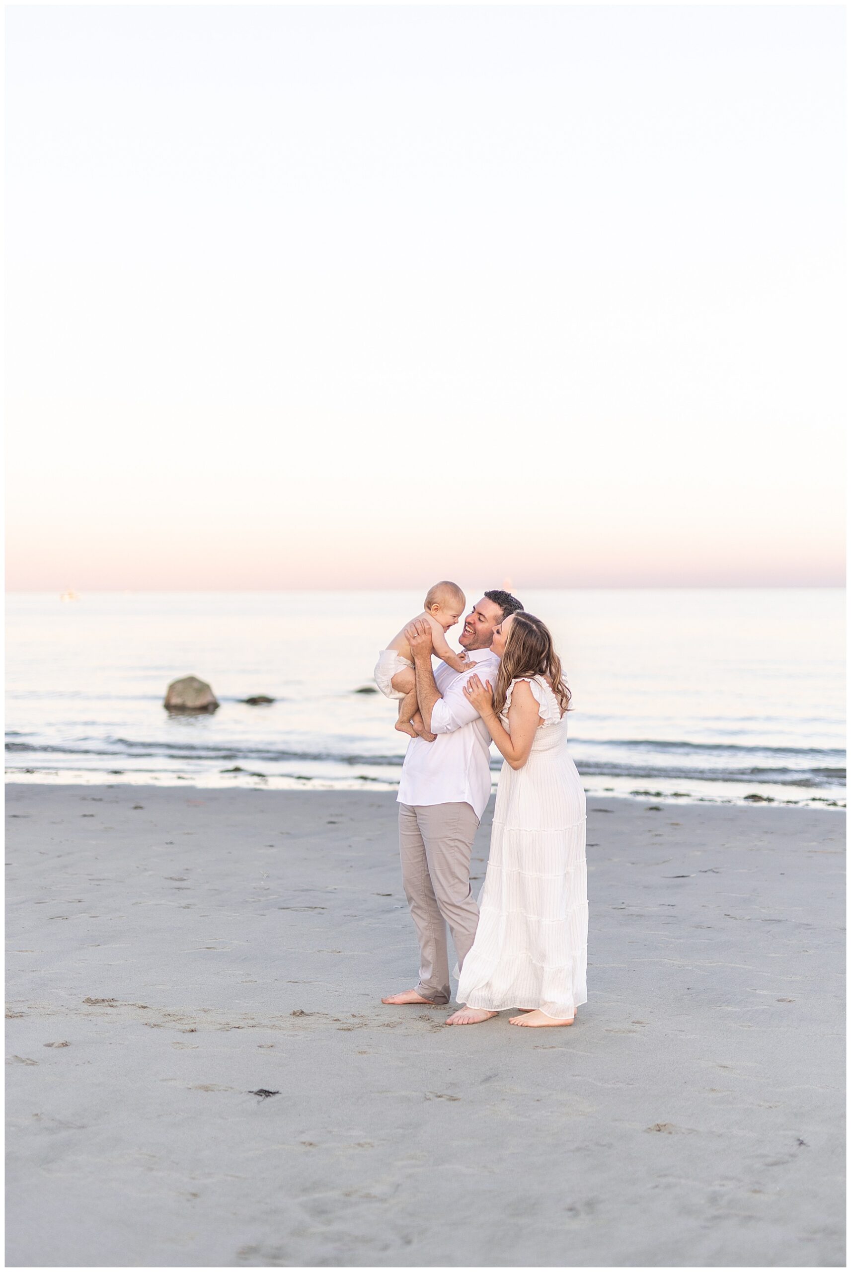 Gorgeous family portrait session on beach in Fairfield County CT with Forty Seven Moments Photography. Luxury family portraits with the full service experience including wardrobe, styling, hair and makeup.